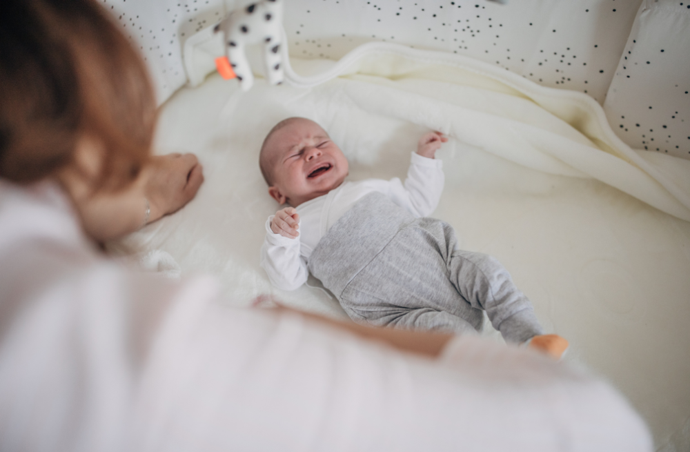 baby crying in a crib