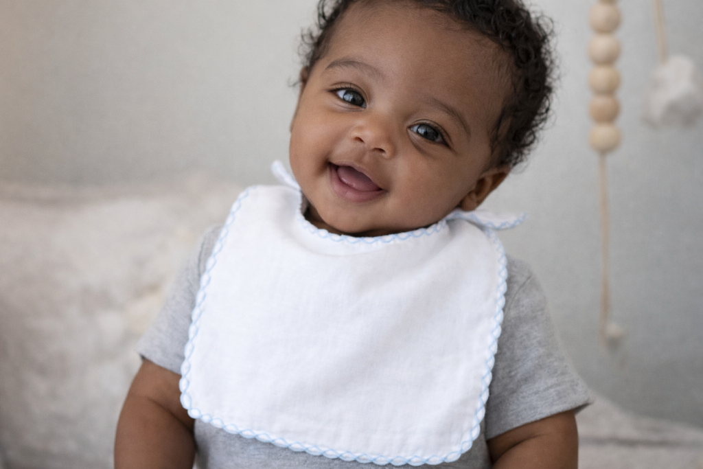 baby wearing a muslin bib