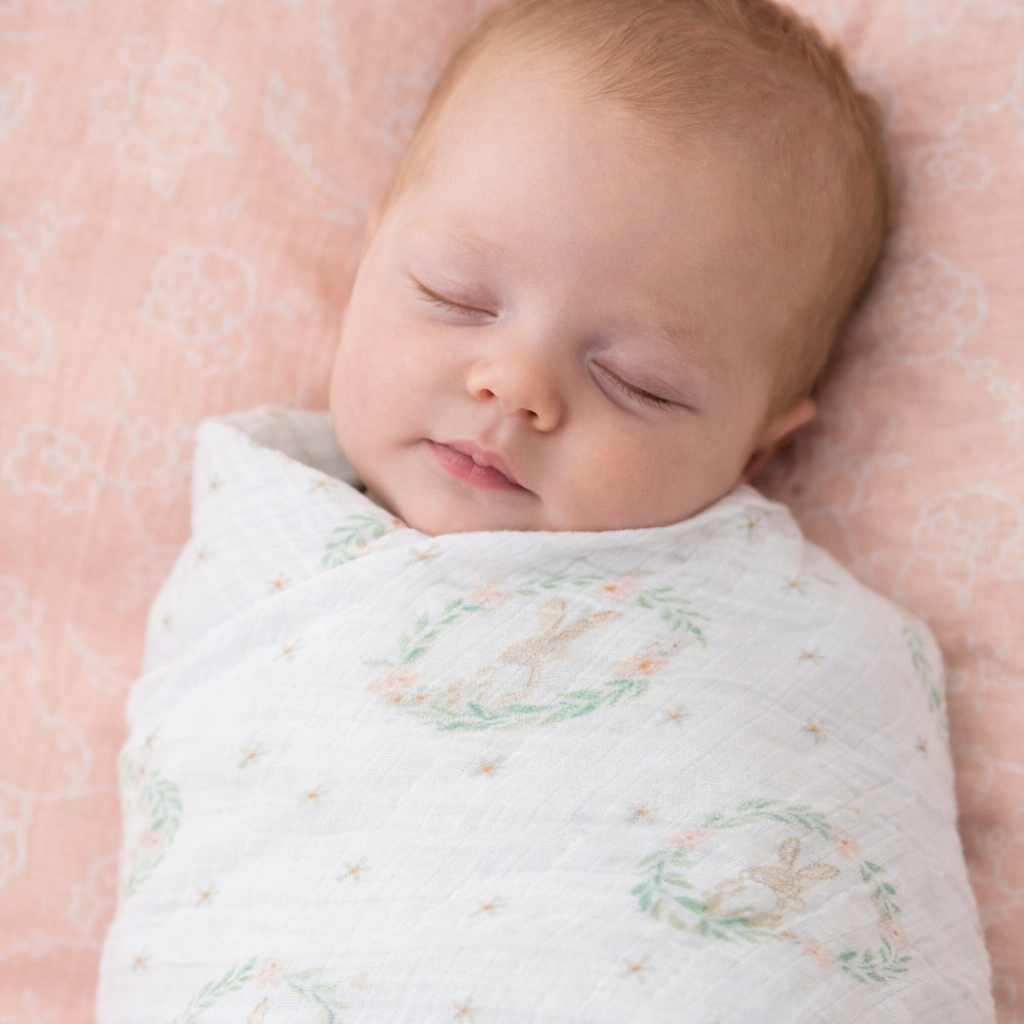 baby swaddled in muslin