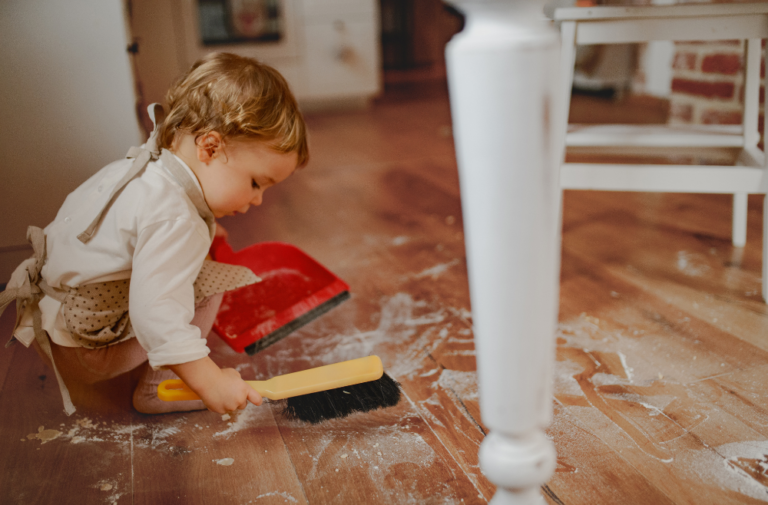 toddler cleaning the floor
