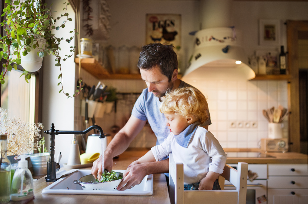 learning tower dad and toddler in kitchen