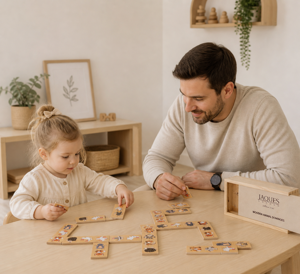 father and daughter playing educational game picture dominoes