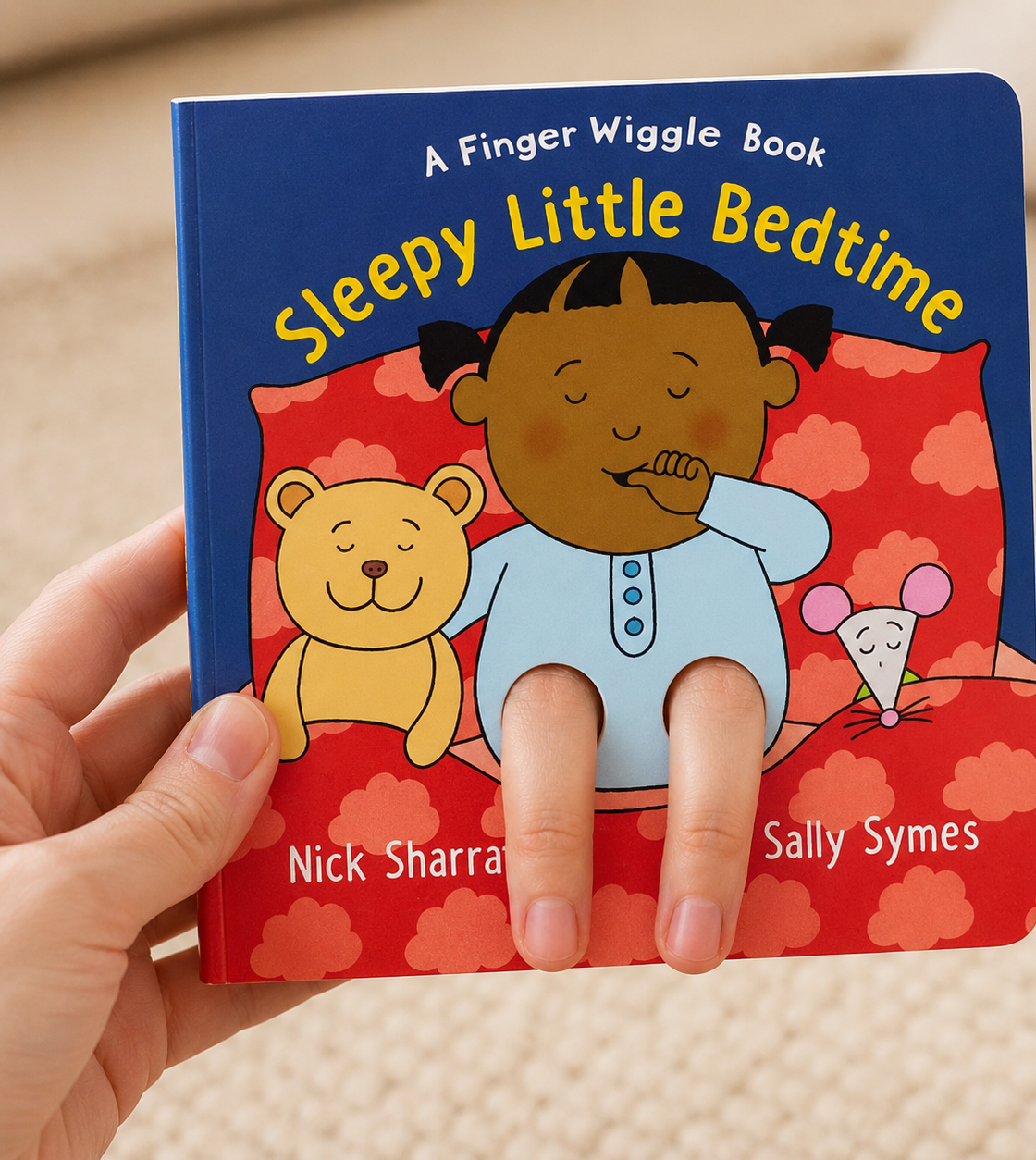 Sleepy Little Bedtime: A Finger Wiggle Book for babies where you poke your fingers through to create legs of the character in the book.