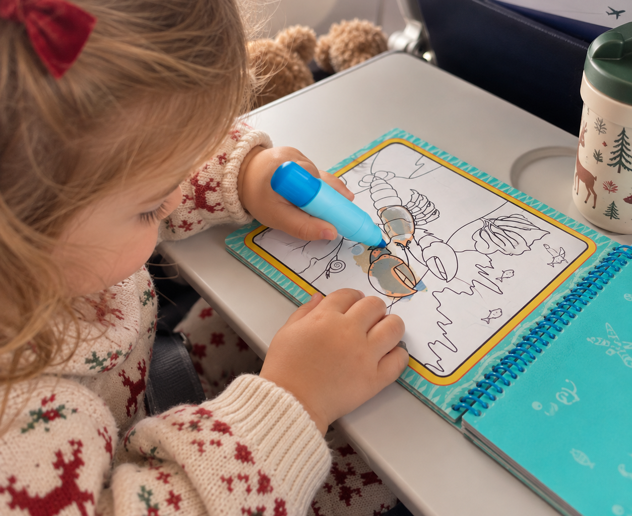 Water Wow book being used by a toddler on the plane.